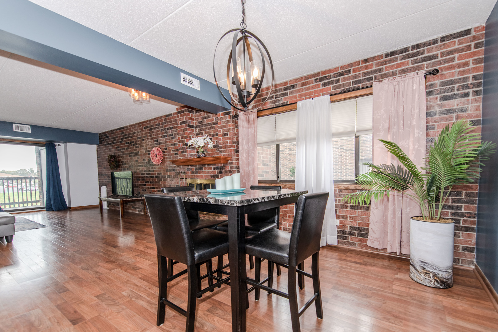 1504 Woodbridge Road, Unit 2E Joliet, IL 60436 - Photo 6 of 34 a view of a dining room with furniture window and wooden floor