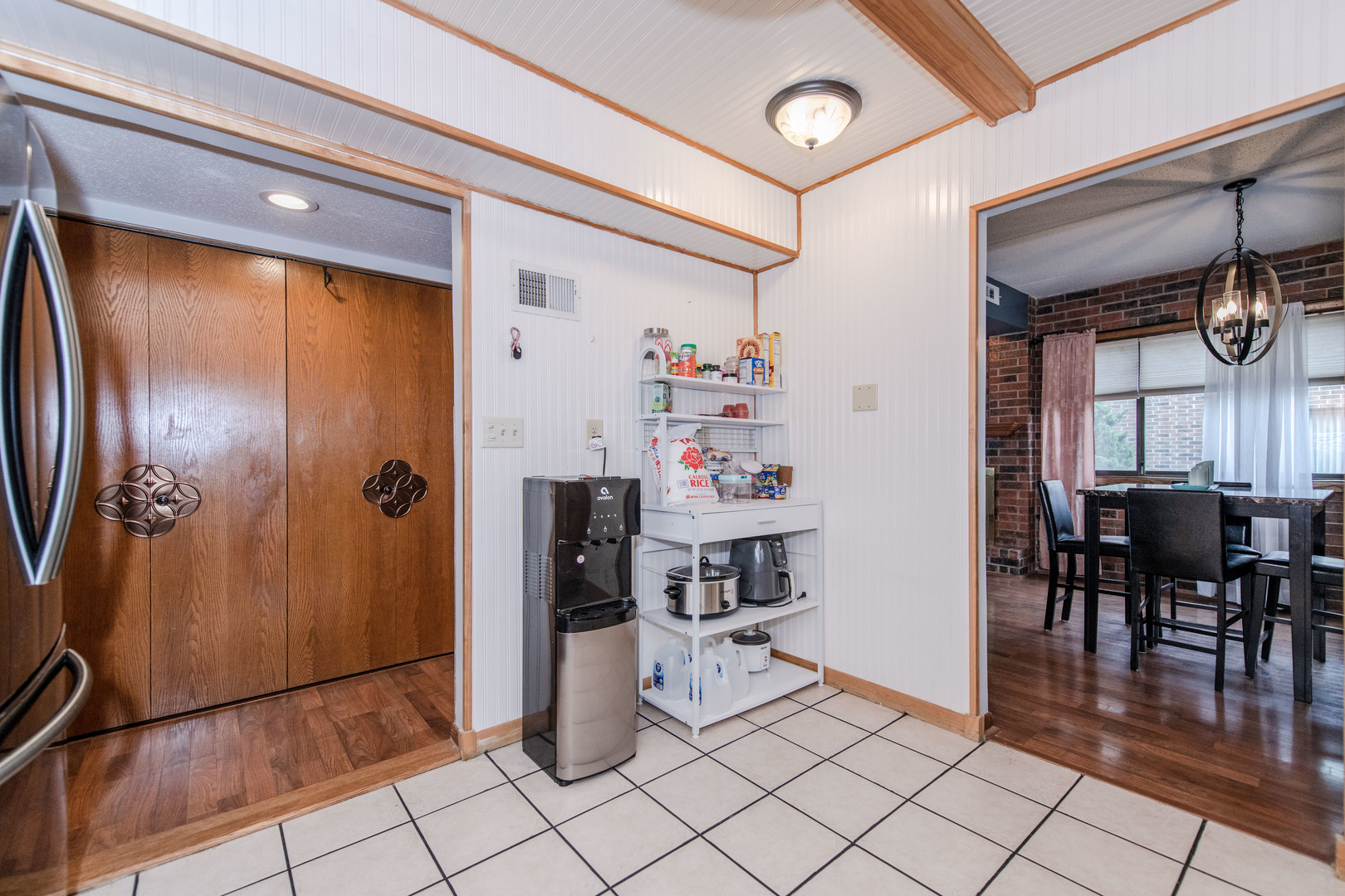 1504 Woodbridge Road, Unit 2E Joliet, IL 60436 - Photo 9 of 34 a view of kitchen with furniture and wooden floor