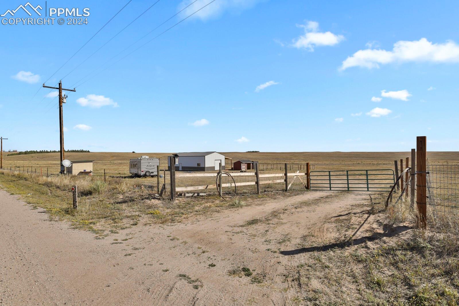 12155 Oil Well Road Calhan, CO 80808 - Photo 6 of 28 Gated entrance with convenient access from Oil Well Road