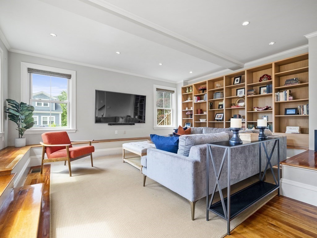 99 Sedgwick Street, Unit 1 Boston, MA 02130 - Photo 12 of 41 a living room with furniture and a flat screen tv