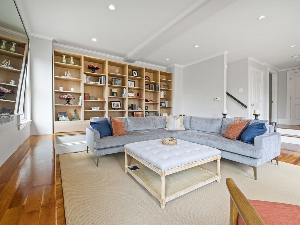 99 Sedgwick Street, Unit 1 Boston, MA 02130 - Photo 13 of 41 a living room with furniture and wooden floor