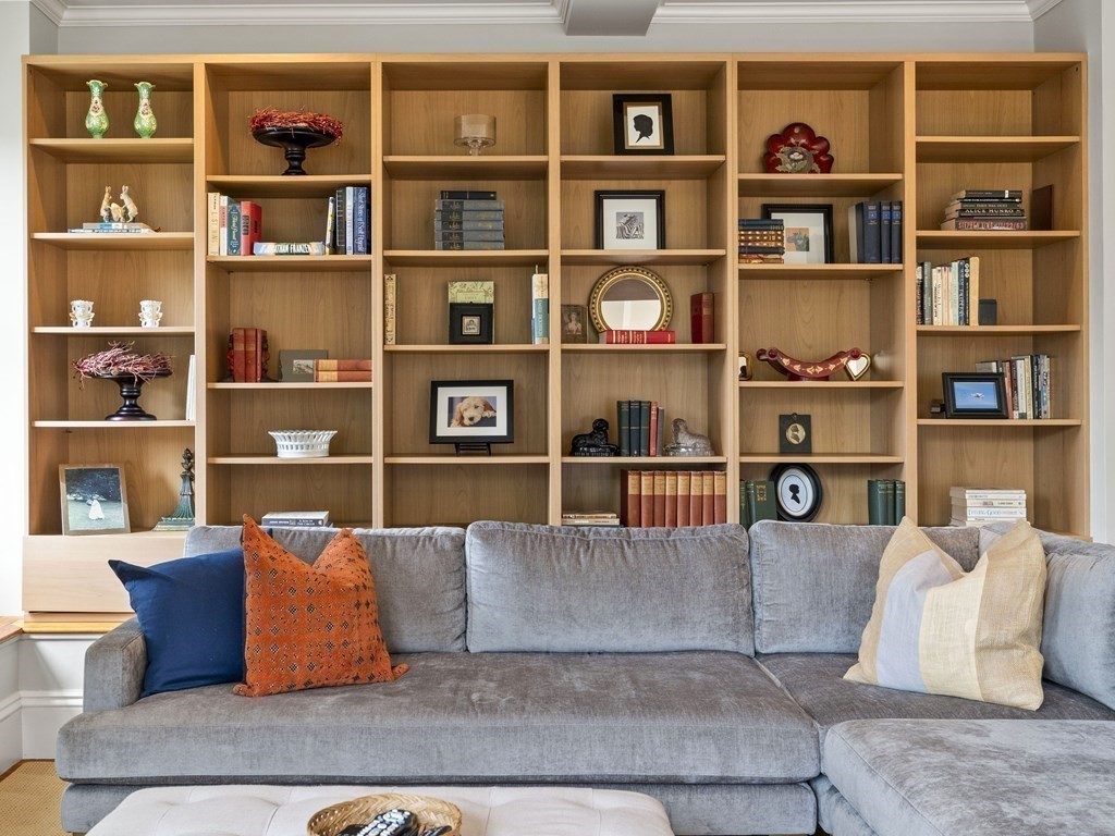99 Sedgwick Street, Unit 1 Boston, MA 02130 - Photo 15 of 41 a living room with furniture cabinets and book shelf