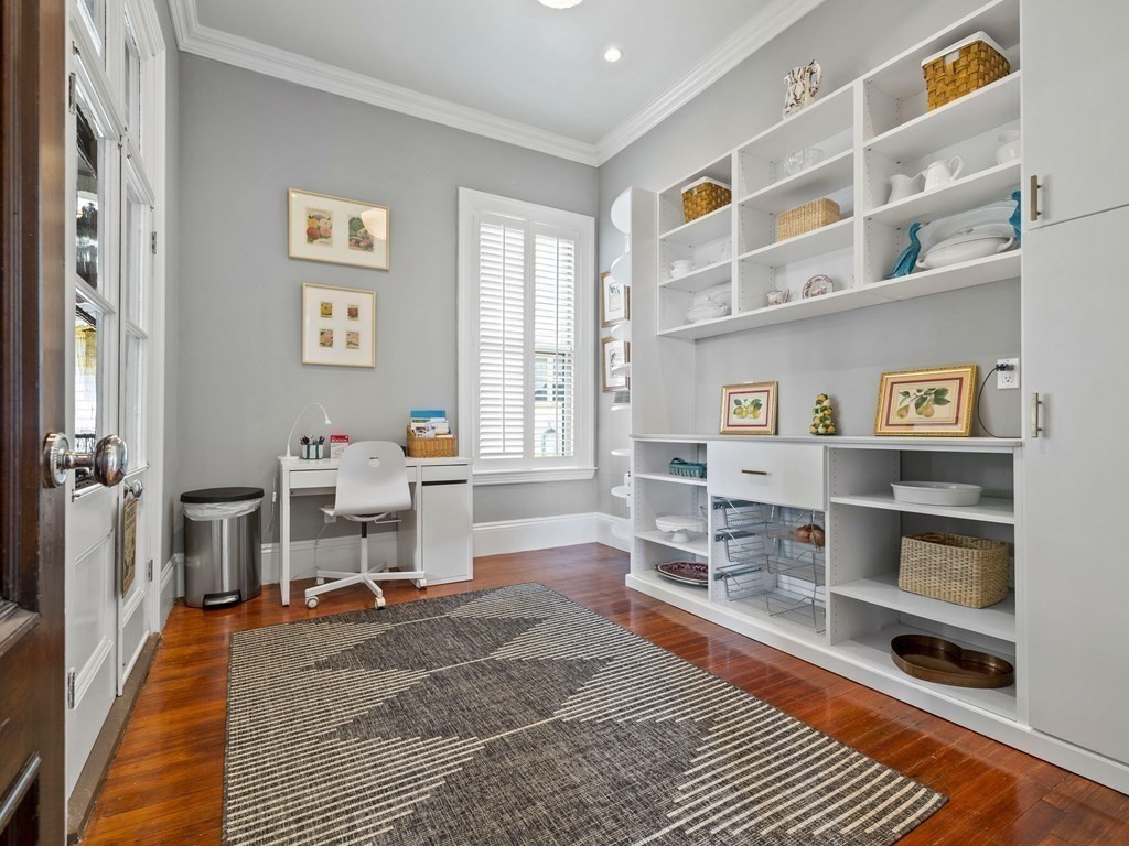 99 Sedgwick Street, Unit 1 Boston, MA 02130 - Photo 16 of 41 a living room with furniture a rug and a window