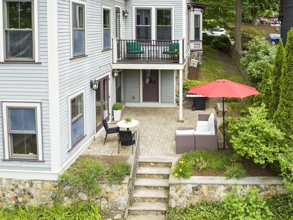 99 Sedgwick Street, Unit 1 Boston, MA 02130 - Photo 29 of 41 a front view of a house with an outdoor space and porch