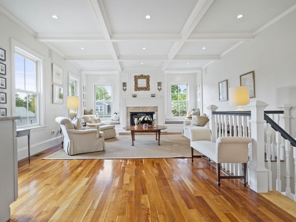 99 Sedgwick Street, Unit 1 Boston, MA 02130 - Photo 3 of 41 a living room with fireplace furniture and a wooden floor
