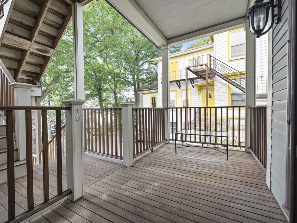 99 Sedgwick Street, Unit 1 Boston, MA 02130 - Photo 32 of 41 a view of a balcony with wooden floor