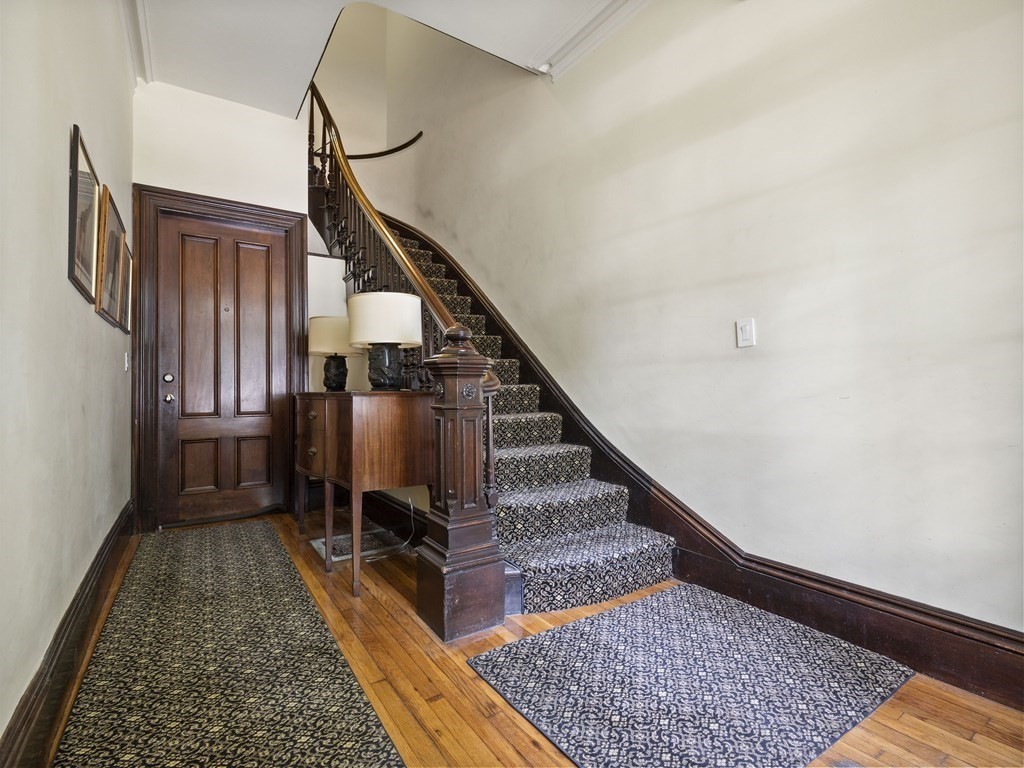 99 Sedgwick Street, Unit 1 Boston, MA 02130 - Photo 37 of 41 a view of entryway and hall with wooden floor