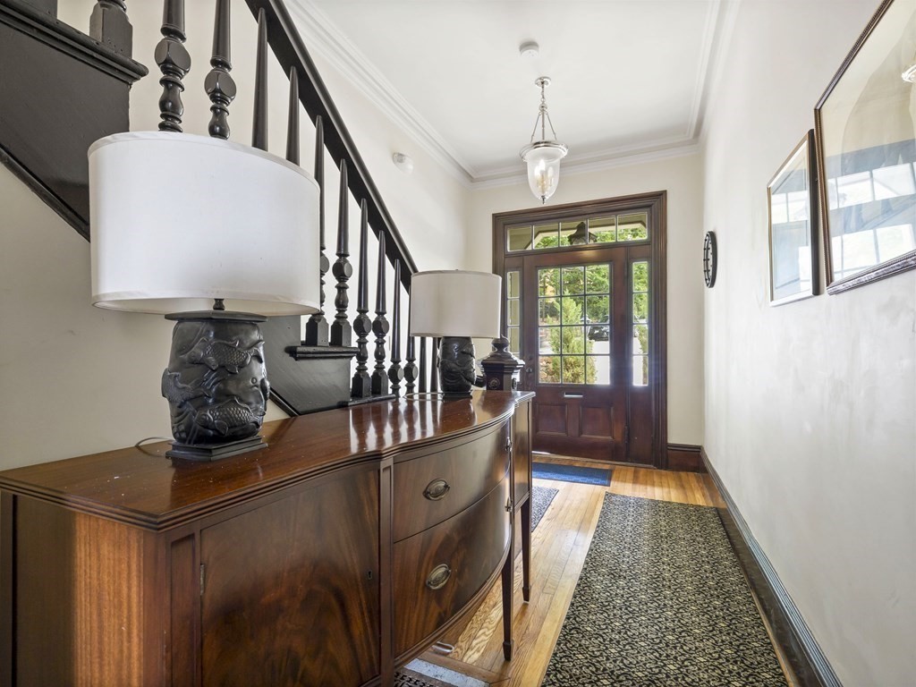 99 Sedgwick Street, Unit 1 Boston, MA 02130 - Photo 38 of 41 a view of entryway and hall with wooden floor