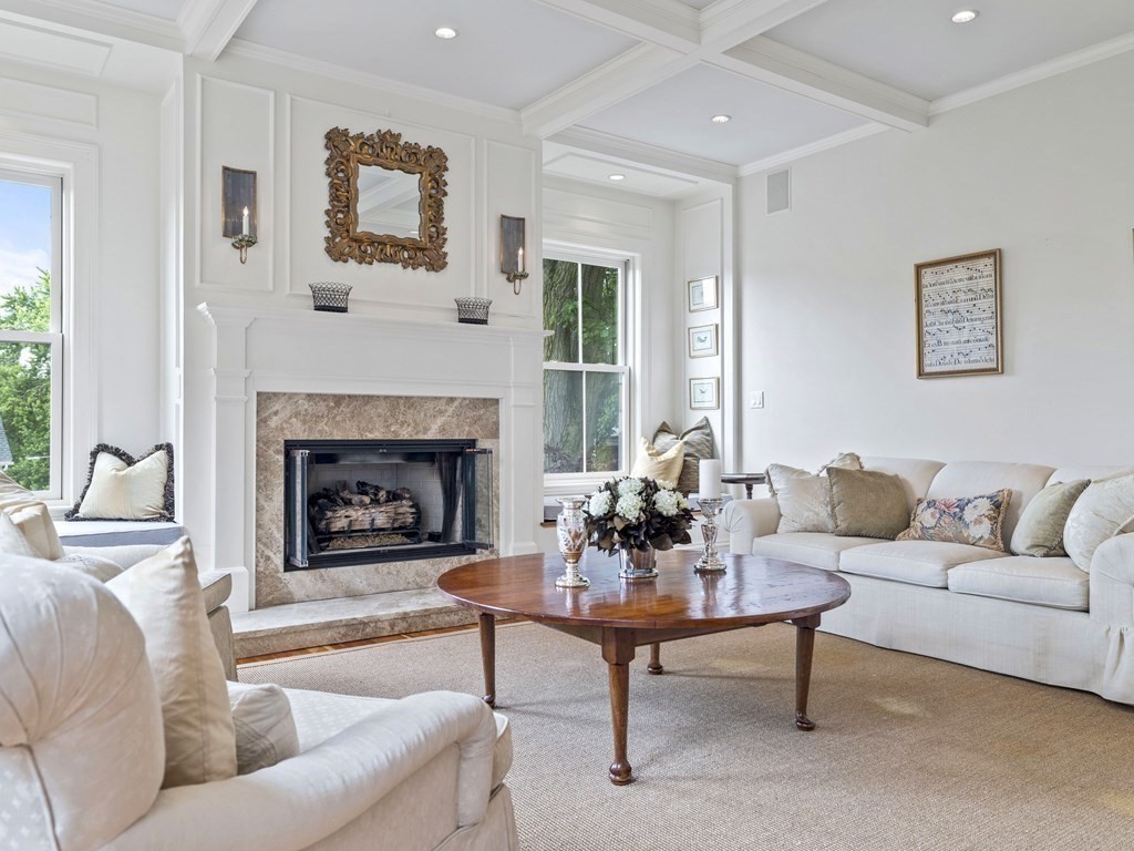 99 Sedgwick Street, Unit 1 Boston, MA 02130 - Photo 5 of 41 a living room with furniture and a fireplace
