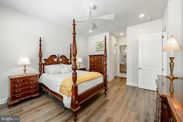 a bed room with a bed and a night stand