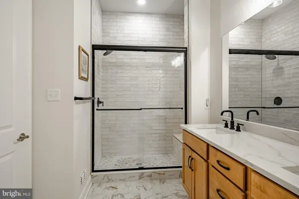 a bathroom with a shower and a sink