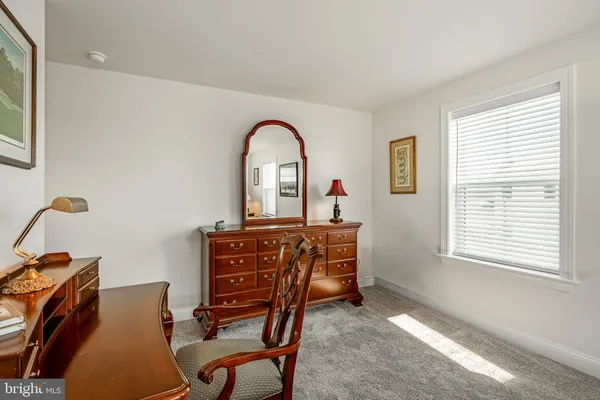 a view of a workspace with furniture
