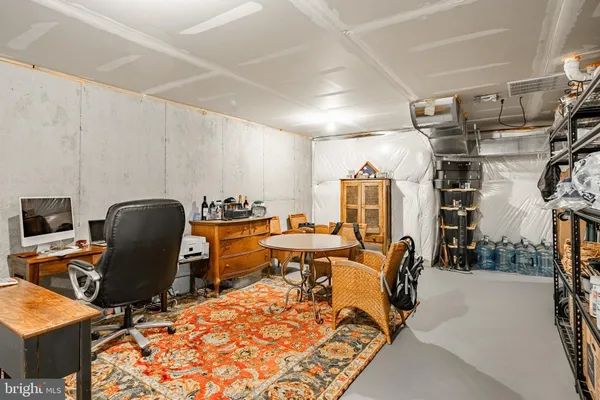 a view of a workspace with furniture