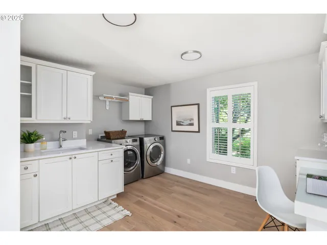 a bedroom with a bed a window and potted plant