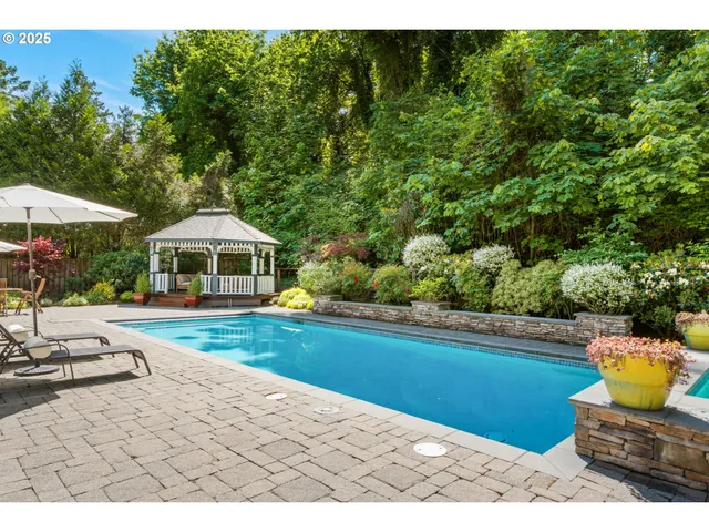 a view of outdoor space with swimming pool and furniture