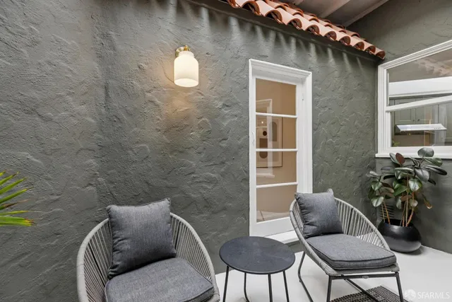 a view of a brick wall and chair