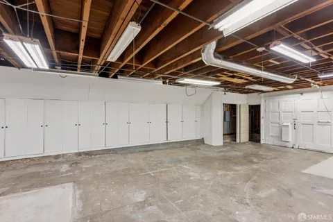 a view of a terrace with couches and wooden floor