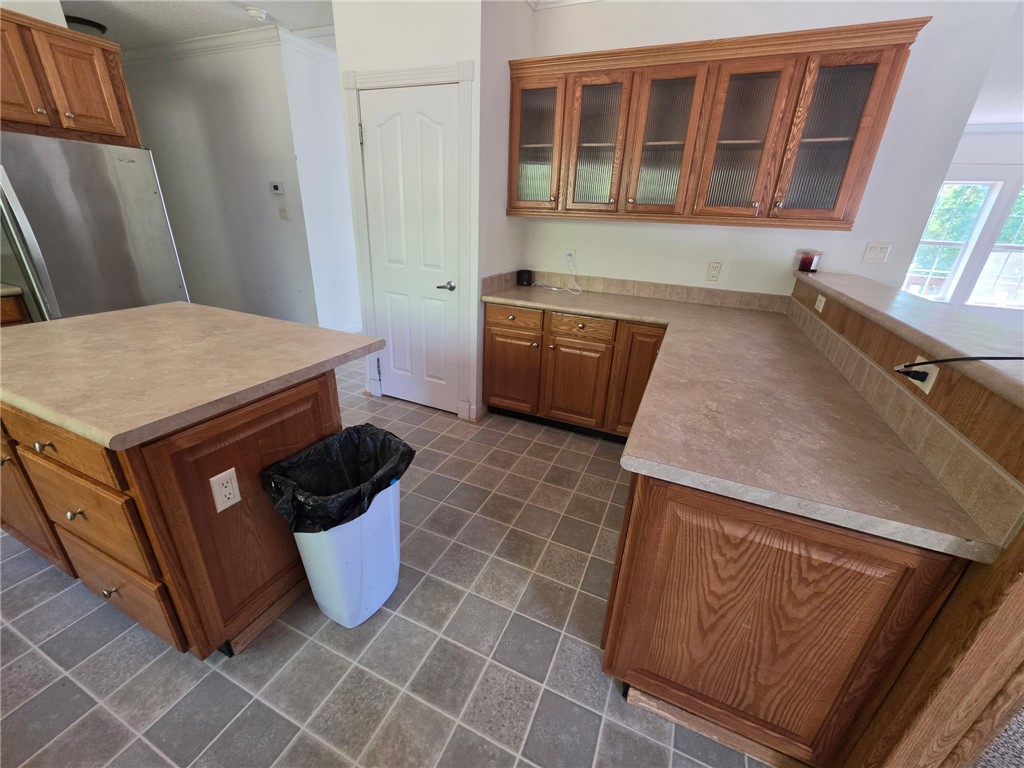 1400 Massey Road Pendleton, SC 29670 - Photo 10 of 25 This spacious kitchen offers ample counter space, rich wooden cabinetry, and durable tile flooring.