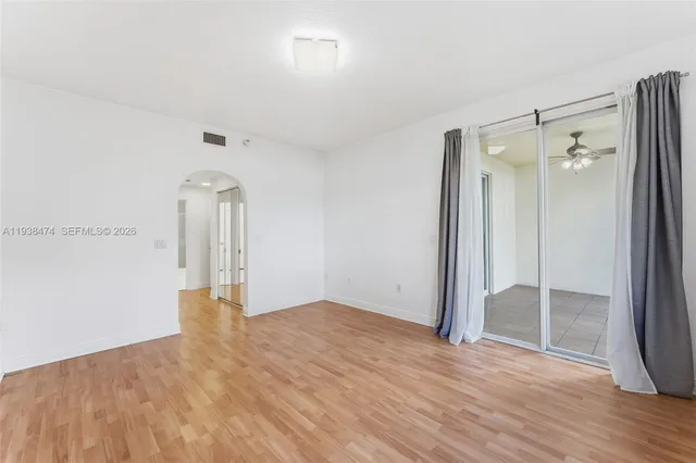 a view of a room with wooden floor