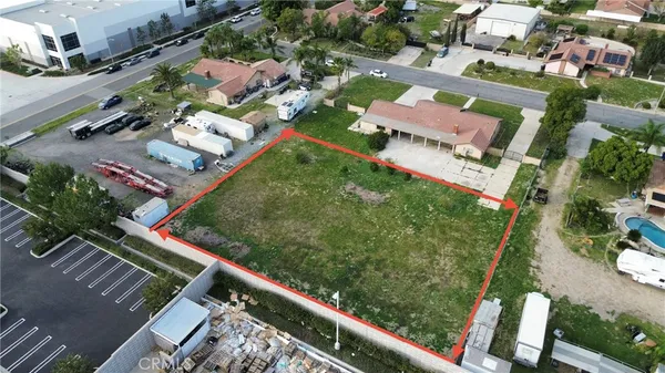 an aerial view of a residential houses with outdoor space