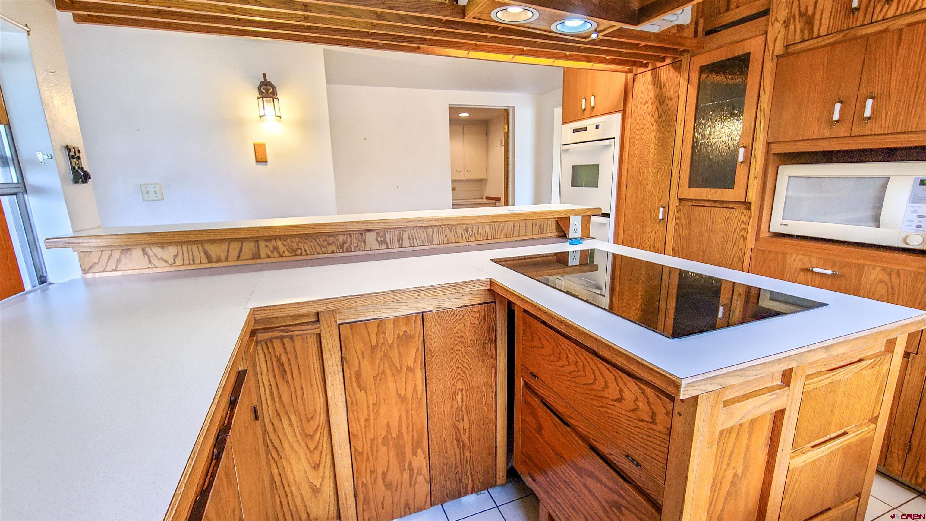 2916 East 7/8 Road Grand Junction, CO 81504 - Photo 14 of 35 a kitchen that has a sink and a microwave oven