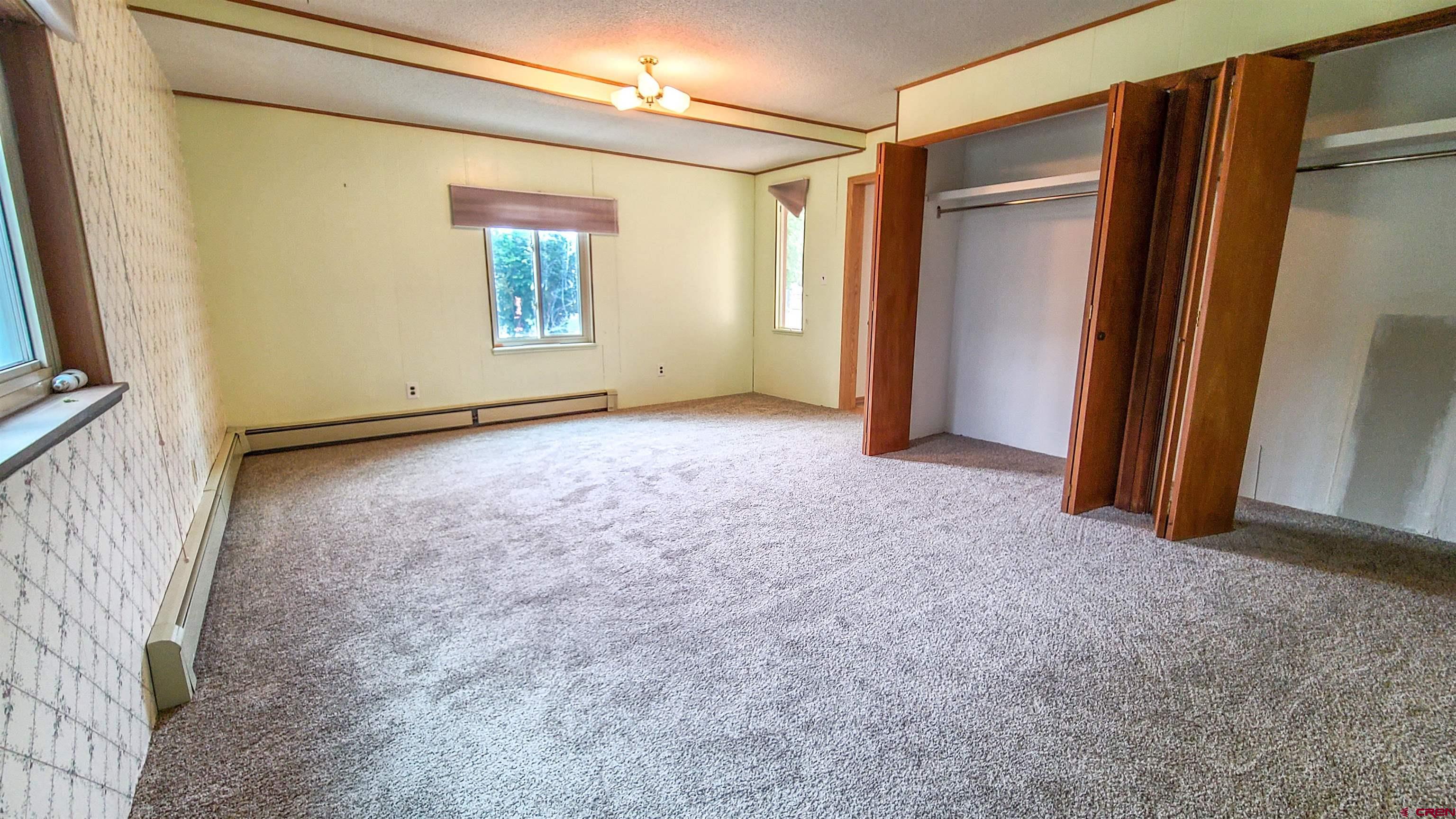 2916 East 7/8 Road Grand Junction, CO 81504 - Photo 15 of 35 an empty room with windows
