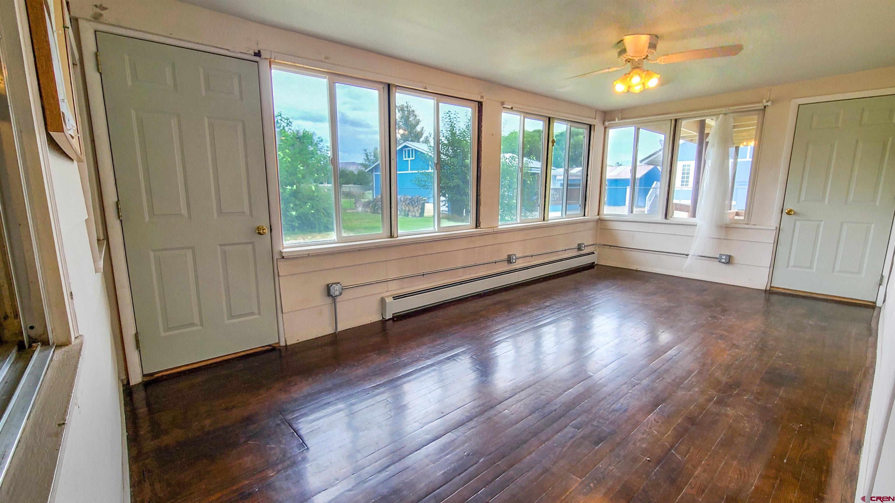 2916 East 7/8 Road Grand Junction, CO 81504 - Photo 28 of 35 a view of room with window and wooden floor