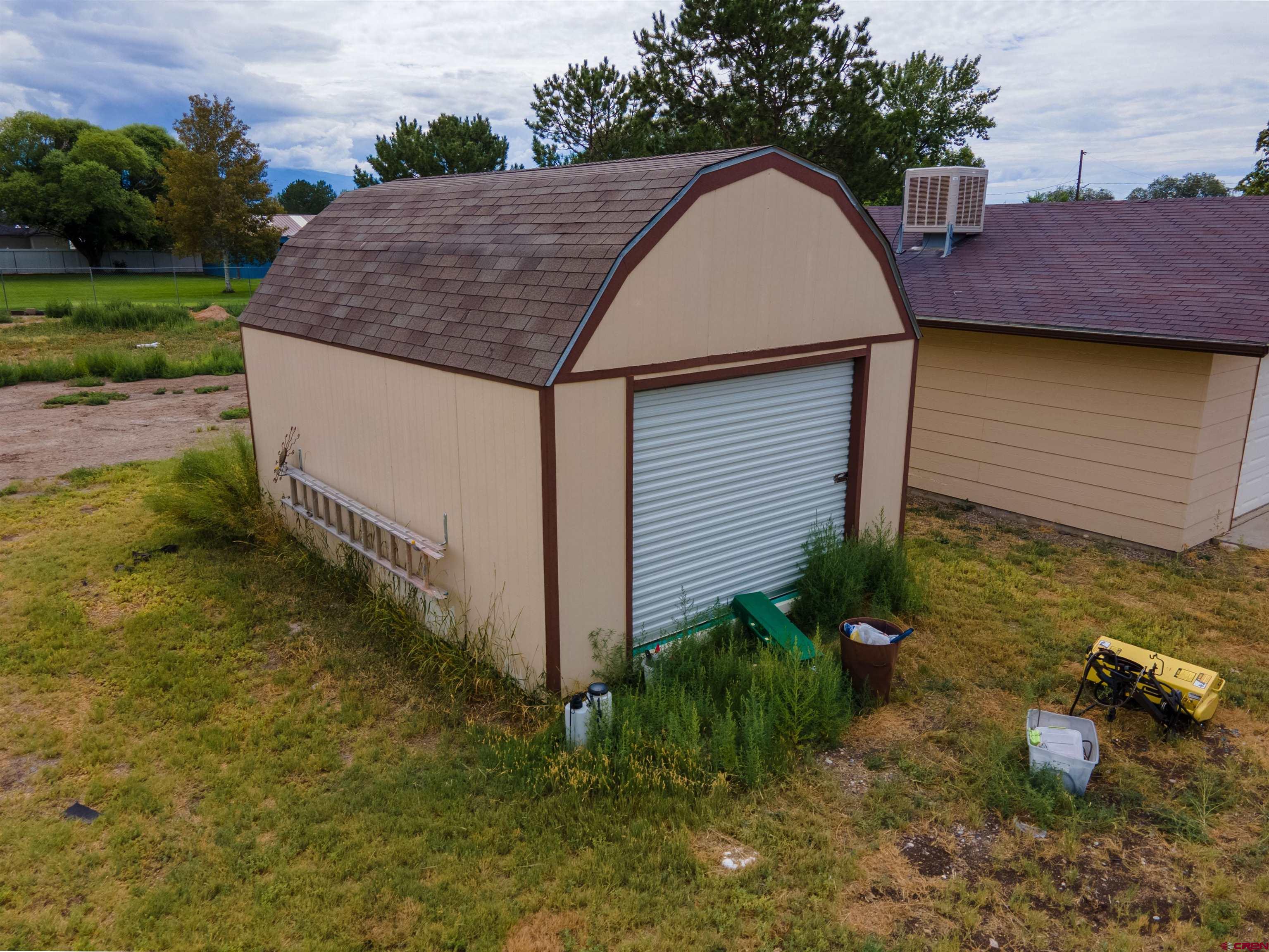 2916 East 7/8 Road Grand Junction, CO 81504 - Photo 32 of 35 a aerial view of a house with garden space and sitting area