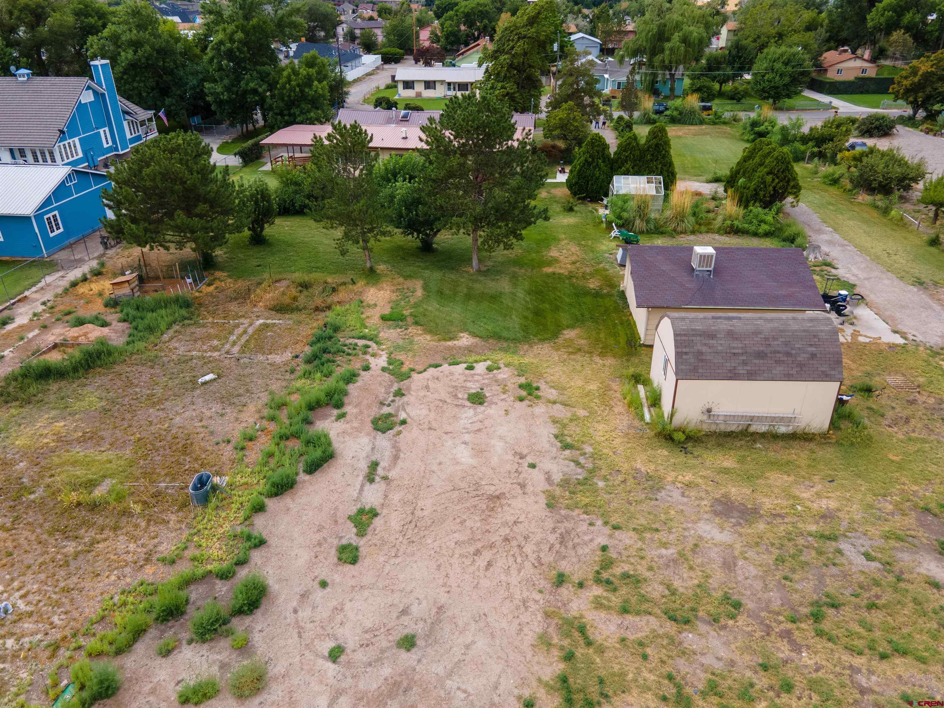 2916 East 7/8 Road Grand Junction, CO 81504 - Photo 34 of 35 an aerial view of a house with a yard