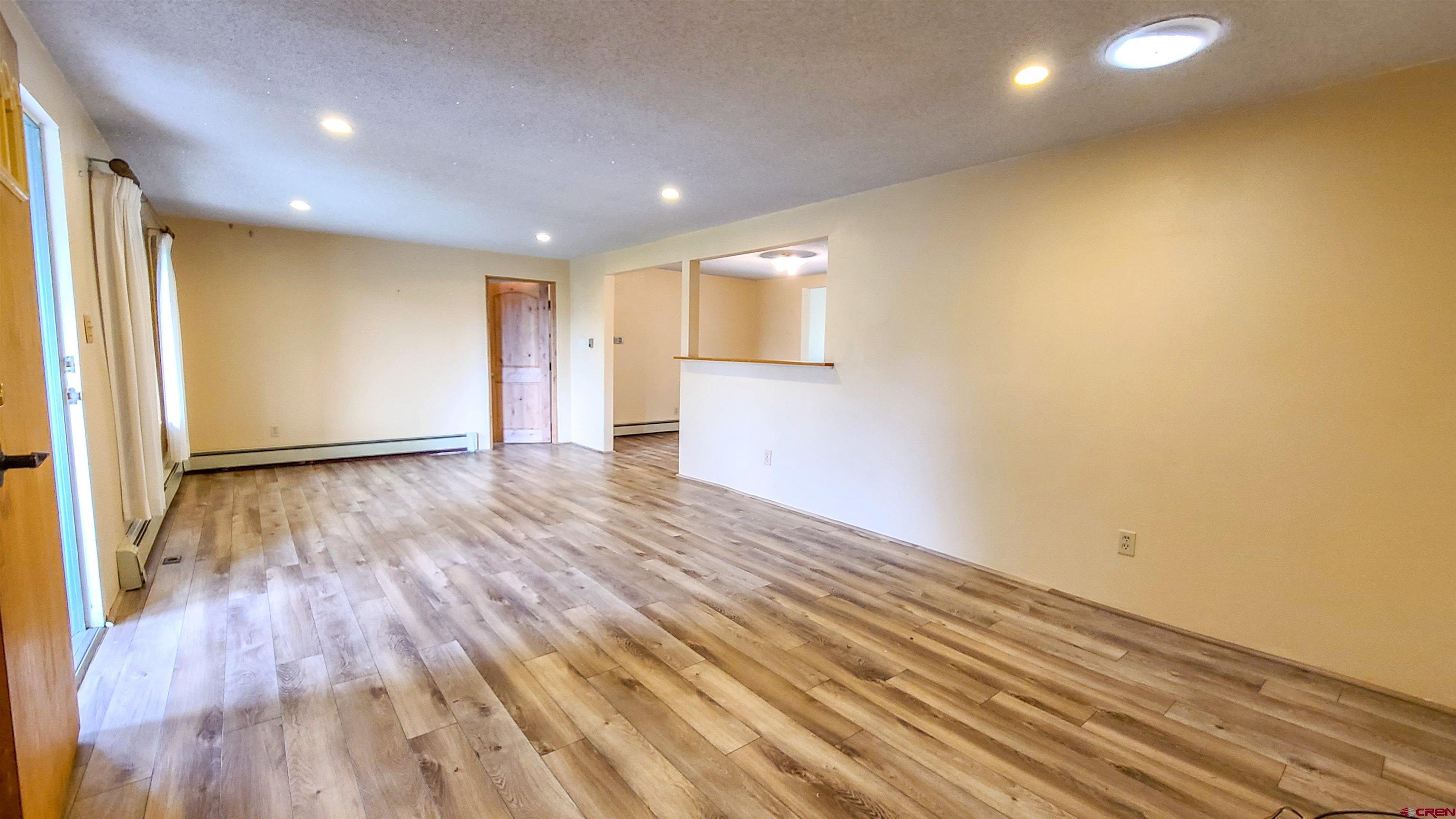 2916 East 7/8 Road Grand Junction, CO 81504 - Photo 6 of 35 a view of empty room with wooden floor