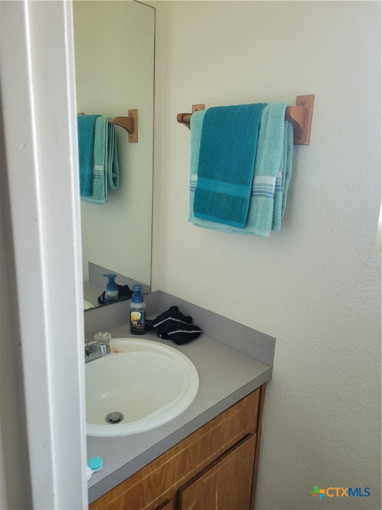 1710 Old FM 440 Road Killeen, TX 76549 - Photo 4 of 6 a bathroom with a sink and a mirror