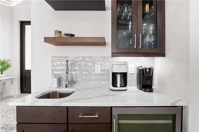 a kitchen with a sink and a refrigerator