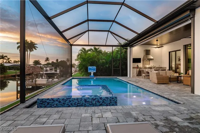 a view of a swimming pool with a porch