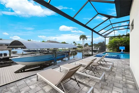a view of a patio with swimming pool