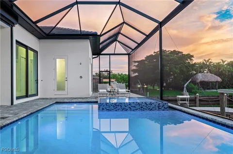 a view of a chairs and table in patio