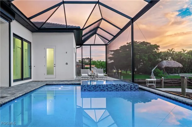 a view of a chairs and table in patio