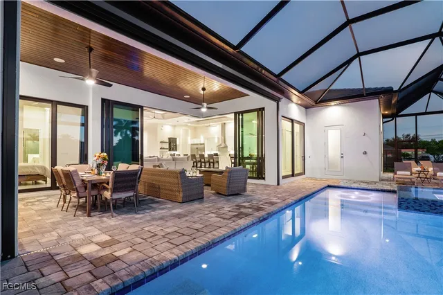 a swimming pool with outdoor seating