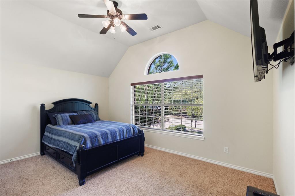 10414 Broadmoor Lane Rowlett, TX 75089 - Photo 26 of 38 Carpeted bedroom featuring a ceiling fan and baseboards