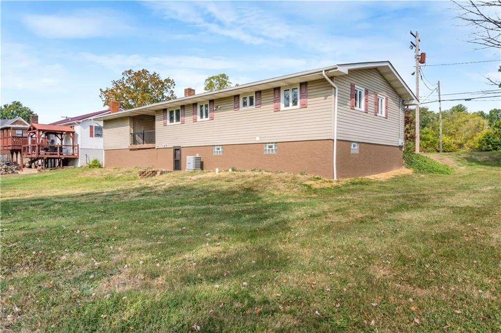 304 Balsinger Road Uniontown, PA 15401 - Photo 13 of 45 a front view of a house with a garden