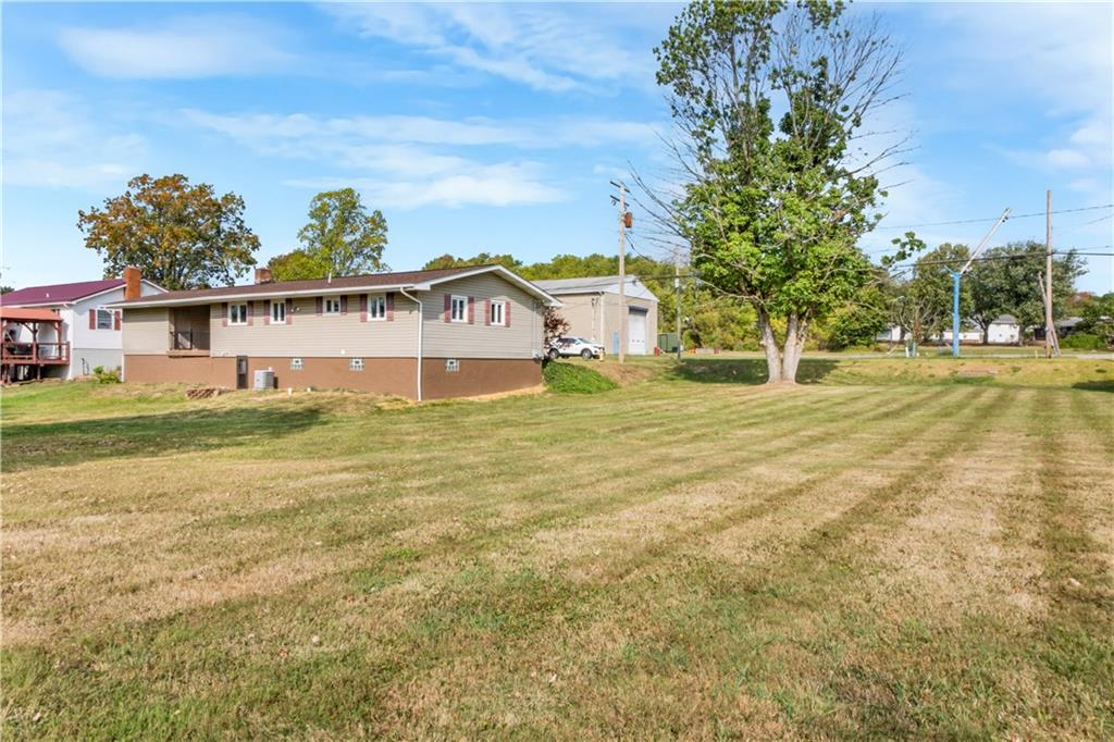 304 Balsinger Road Uniontown, PA 15401 - Photo 14 of 45 a view of a house with a big yard and large trees