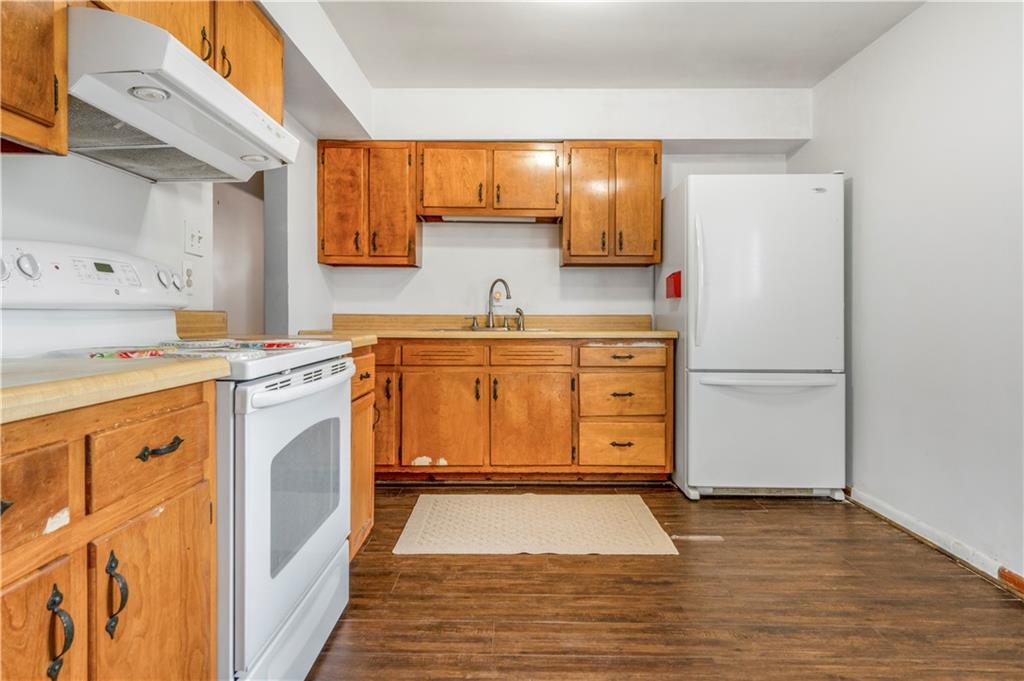 304 Balsinger Road Uniontown, PA 15401 - Photo 25 of 45 a kitchen with stainless steel appliances granite countertop a stove a sink and a refrigerator