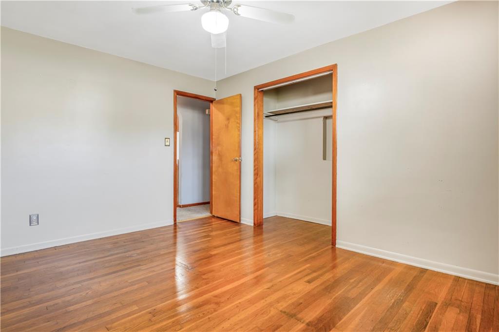 304 Balsinger Road Uniontown, PA 15401 - Photo 39 of 45 a view of an empty room with wooden floor