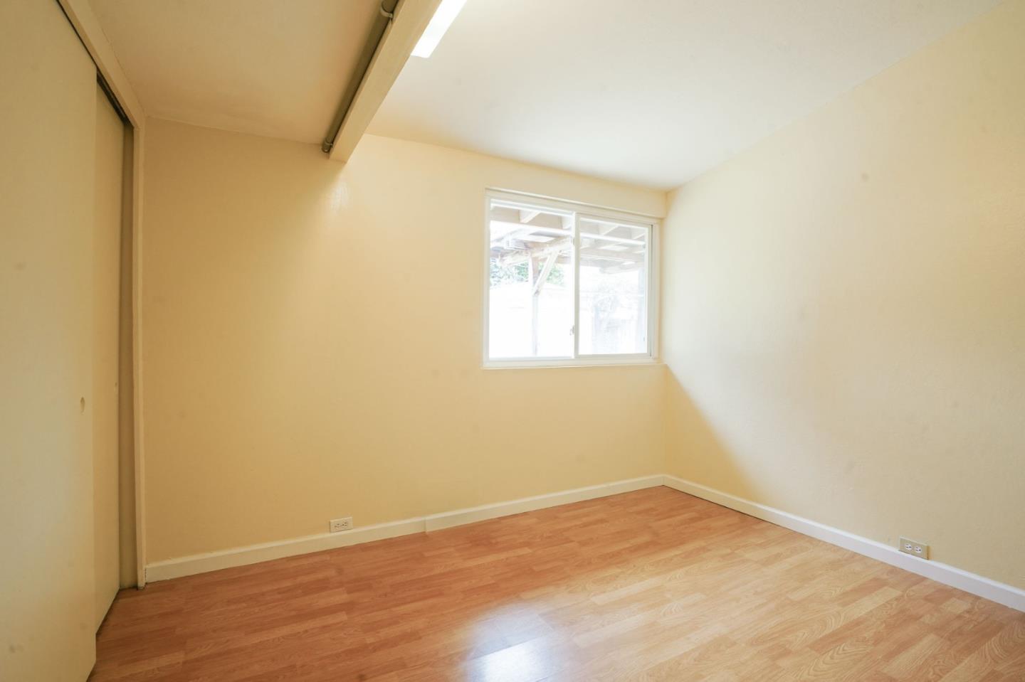 125 Rinaldo Drive Vallejo, CA 94589 - Photo 11 of 36 an empty room with wooden floor and windows