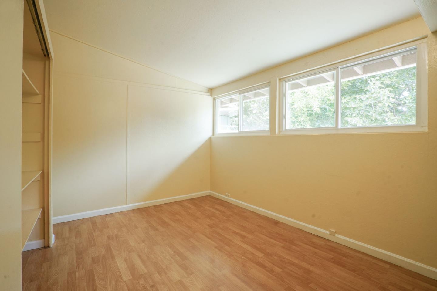 125 Rinaldo Drive Vallejo, CA 94589 - Photo 12 of 36 a view of an empty room with wooden floor and a window
