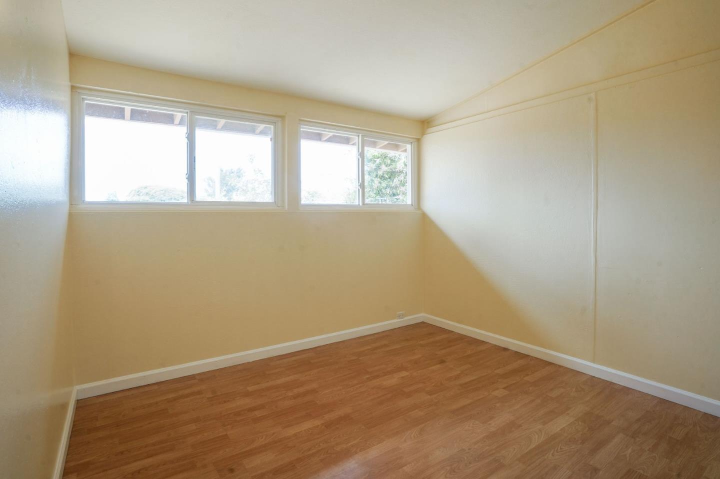 125 Rinaldo Drive Vallejo, CA 94589 - Photo 13 of 36 wooden floor in an empty room with a window