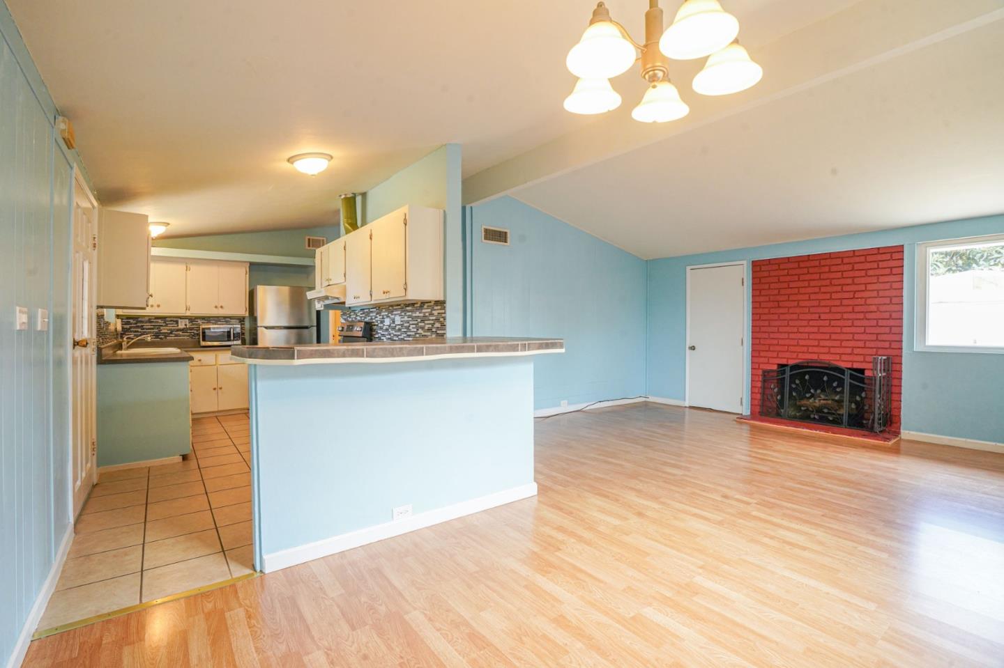 125 Rinaldo Drive Vallejo, CA 94589 - Photo 5 of 36 a view of kitchen with cabinets and wooden floor