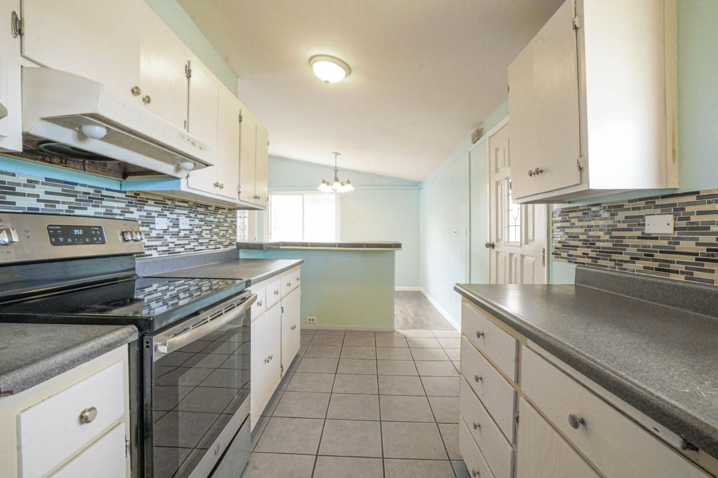 125 Rinaldo Drive Vallejo, CA 94589 - Photo 10 of 36 a kitchen with stainless steel appliances granite countertop a stove a sink and a microwave