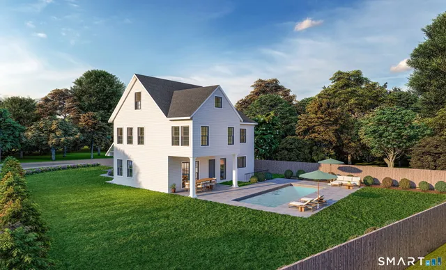 a view of a house with a yard and sitting area