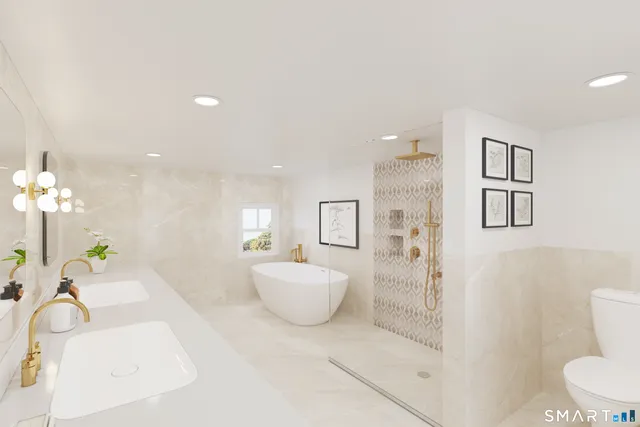 a spacious bedroom with a bed a couch and a view of bathroom