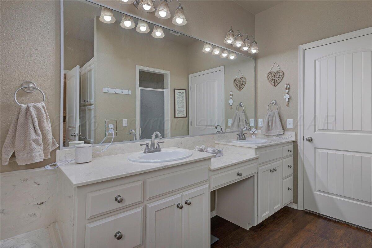 4801 Cedar Springs Trail Amarillo, TX 79119 - Photo 17 of 41 a bathroom with a double vanity sink and a mirror